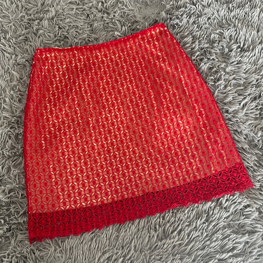 Women’s skirt. Red lace with tan silky underlay. Size M